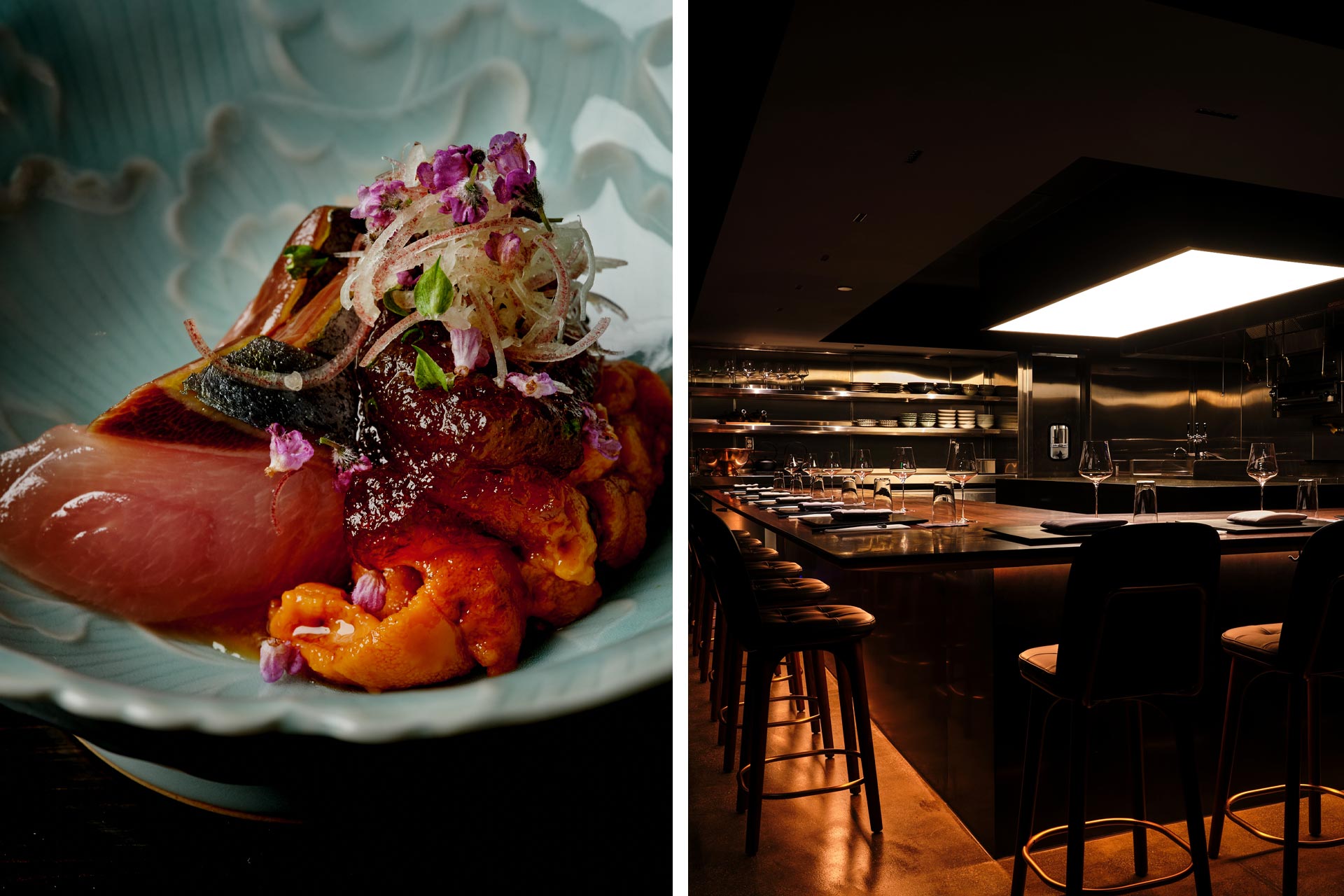 Plated dish with seared protein, burgundy glaze, purple flowers, and crispy noodles on white ceramic plate; dining counter with bar seating and warm l
