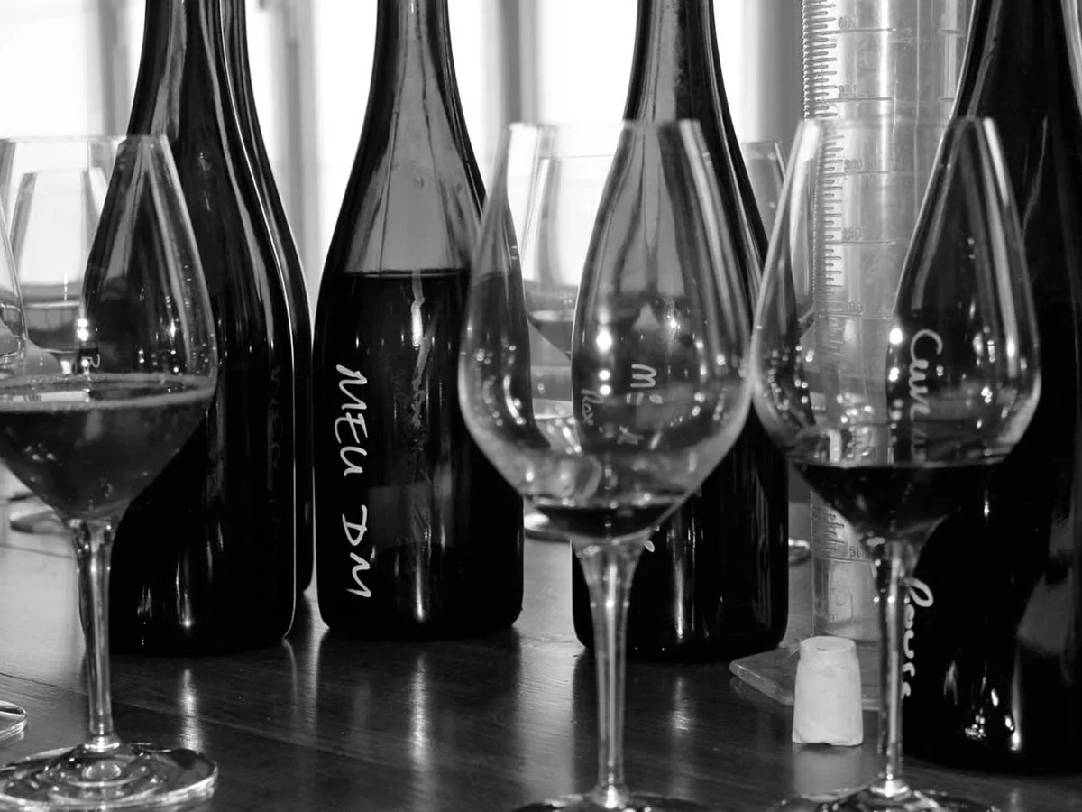 Bottles and glasses on the tasting table at Champagne Geoffroy.